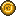 A KIBBLE coin, gold with a paw print on it